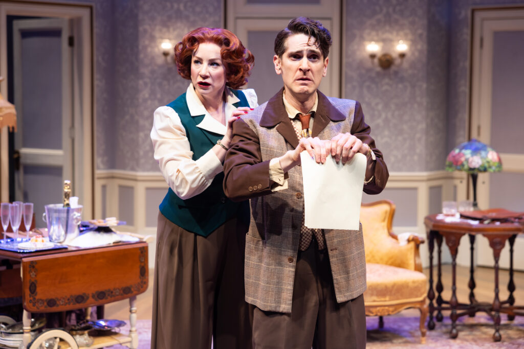 Actress Katy Sullivan and Garrett Lutz, Katy standing slightly behind him with a hand on his shoulder