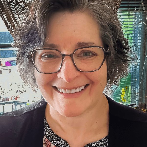 Actress Rosalind Hurwitz in a pair of brown wire rimmed glasses