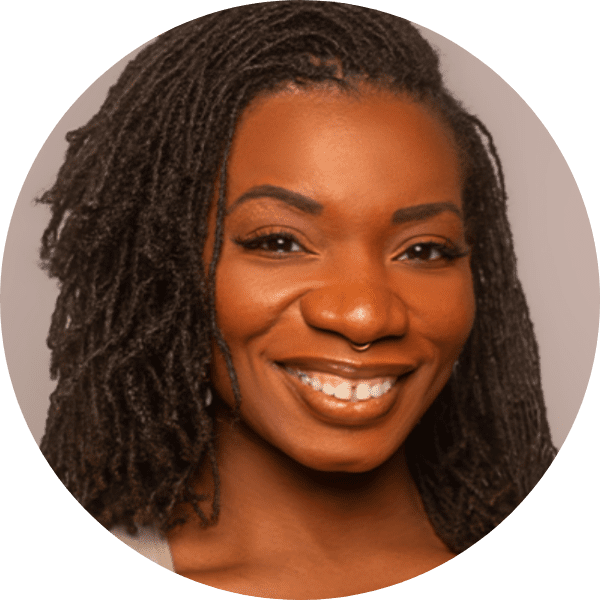 Jyreika Guest posed in front of a gray gradient backdrop