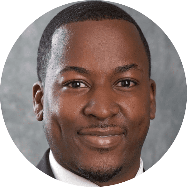 Earl posed in front of a gray gradient backdrop